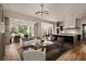 Inviting living space with an open layout, smooth wood floors, modern furniture and stylish accents at 1016 Wildwood Ne Rd, Atlanta, GA 30306