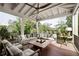 Relaxing covered porch with comfortable seating and peaceful wooded views at 1016 Wildwood Ne Rd, Atlanta, GA 30306
