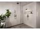 Spacious shower with white tiling, rainfall shower head, handheld sprayer, and convenient built-in niche at 1016 Wildwood Ne Rd, Atlanta, GA 30306