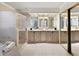 Spacious primary bathroom featuring double vanity, glass shower, and tile flooring at 3711 Spinnaker Cir, Alpharetta, GA 30005