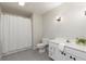 This traditional bathroom has a shower and a white vanity sink at 3711 Spinnaker Cir, Alpharetta, GA 30005