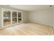This light-filled bedroom boasts large windows with a view of the landscaped yard at 3711 Spinnaker Cir, Alpharetta, GA 30005