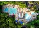 An aerial view of a community pool and lounge area, with trees surrounding the area at 3711 Spinnaker Cir, Alpharetta, GA 30005