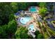 Aerial view of a community pool and clubhouse with plenty of seating and lounge areas at 3711 Spinnaker Cir, Alpharetta, GA 30005