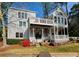 Back exterior view with two porches and lush landscaping at 3711 Spinnaker Cir, Alpharetta, GA 30005