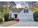 Charming single-Gathering home with gray siding, a two-car garage, and beautiful landscaping at 3711 Spinnaker Cir, Alpharetta, GA 30005