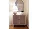 Close-up view of a stylish cabinet with decor, enhancing the hallway's aesthetic appeal at 3711 Spinnaker Cir, Alpharetta, GA 30005