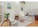Spacious living room with a fireplace, comfortable seating, and natural light, perfect for relaxation and gatherings at 3711 Spinnaker Cir, Alpharetta, GA 30005