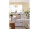 Comfortable living room with a chandelier and a view into the dining area with plants at 3711 Spinnaker Cir, Alpharetta, GA 30005