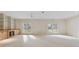 A large living room area featuring shelving, French doors and carpet at 3711 Spinnaker Cir, Alpharetta, GA 30005