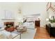 Inviting living room with a fireplace, open layout, and hardwood floors, creating a warm and connected space at 3711 Spinnaker Cir, Alpharetta, GA 30005