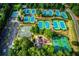 Aerial view of multiple well-maintained tennis courts and a parking lot at 3711 Spinnaker Cir, Alpharetta, GA 30005