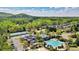 Aerial shot of the community amenities, including a pool, playground, and tennis courts at 512 Watercress Dr, Woodstock, GA 30188