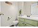 Cozy half bathroom featuring modern fixtures and stylish decorations at 512 Watercress Dr, Woodstock, GA 30188