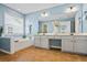 Spacious primary bathroom featuring double sinks, a soaking tub, and modern fixtures at 512 Watercress Dr, Woodstock, GA 30188
