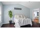 Comfortable bedroom with hardwood floors and stylish decor at 512 Watercress Dr, Woodstock, GA 30188