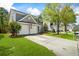Charming two-story home with a two-car garage and well-maintained front yard at 512 Watercress Dr, Woodstock, GA 30188