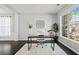 Bright home office with large windows and a view of the neighborhood at 512 Watercress Dr, Woodstock, GA 30188