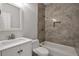 Nicely renovated bathroom featuring new fixtures, a shower-tub combo, and lovely tile work at 625 Park Creek Trce, Alpharetta, GA 30005