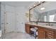 Spa-like bathroom with double vanity, granite counters, tile flooring, and a glass enclosed shower at 625 Park Creek Trce, Alpharetta, GA 30005