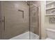 Stylish bathroom featuring a glass-enclosed shower over tub with decorative shelving at 625 Park Creek Trce, Alpharetta, GA 30005