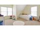 Bright room with a simple bed, playroom accessories, and natural light from large windows at 625 Park Creek Trce, Alpharetta, GA 30005