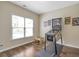 Fun bedroom with hardwood floors, bright window, and retro pinball machine at 625 Park Creek Trce, Alpharetta, GA 30005