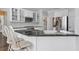 Kitchen with stainless steel appliances, granite countertop island and hardwood flooring at 625 Park Creek Trce, Alpharetta, GA 30005