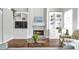Cozy living room with a fireplace and built-in shelving perfect for displaying decor at 625 Park Creek Trce, Alpharetta, GA 30005
