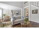 Comfortable open concept living space featuring a fireplace, dining area, and kitchen at 625 Park Creek Trce, Alpharetta, GA 30005