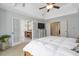 Large main bedroom with a tray ceiling, bright windows, and ensuite bathroom access at 625 Park Creek Trce, Alpharetta, GA 30005