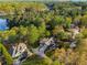 An aerial view of the lakeside property showing both homes and lake access at 6477 Old Shadburn Ferry Rd, Buford, GA 30518