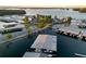 Aerial shot of the harbor features well-organized boat docks along the tranquil lake at sunset at 6477 Old Shadburn Ferry Rd, Buford, GA 30518