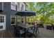 A large back deck features a table with seating, with views of the lake at 6477 Old Shadburn Ferry Rd, Buford, GA 30518