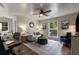 A well-lit bedroom features a comfortable seating area, soft colors, and ample natural light from the windows at 6477 Old Shadburn Ferry Rd, Buford, GA 30518