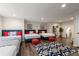 Spacious playroom with hardwood floors, multiple beds, game decor and lots of lighting at 6477 Old Shadburn Ferry Rd, Buford, GA 30518
