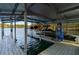 Covered boat slip featuring lifts with watercrafts and kayaks at 6477 Old Shadburn Ferry Rd, Buford, GA 30518