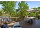 Spacious deck with comfortable seating and table, perfect for enjoying outdoor meals overlooking the lake at 6477 Old Shadburn Ferry Rd, Buford, GA 30518