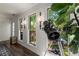 Window seating area with ship lap walls, modern light fixtures, large windows with backyard views, and a telescope at 6477 Old Shadburn Ferry Rd, Buford, GA 30518