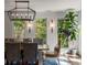 Dining room with ship lap walls, modern lighting fixture, large windows, and a charming view of outdoor greenery at 6477 Old Shadburn Ferry Rd, Buford, GA 30518