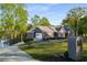 Lovely single-story home boasting a lush lawn, spacious driveway, and attached garage near the waterfront at 6477 Old Shadburn Ferry Rd, Buford, GA 30518