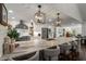 Spacious kitchen featuring a large island with seating, stainless appliances, and bright white cabinetry at 6477 Old Shadburn Ferry Rd, Buford, GA 30518