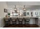 Gourmet kitchen with seating, an island, and stainless steel appliances at 6477 Old Shadburn Ferry Rd, Buford, GA 30518