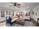 Open concept living room connects to the kitchen and features lots of natural light at 6477 Old Shadburn Ferry Rd, Buford, GA 30518