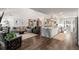 Spacious open concept living room and kitchen featuring hardwood floors and ample natural light at 6477 Old Shadburn Ferry Rd, Buford, GA 30518