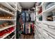 Walk-in closet with custom shelving and organization system provides ample space for storage at 6477 Old Shadburn Ferry Rd, Buford, GA 30518