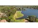 Stunning aerial view of lakefront golf course surrounded by lush greenery at 1010 Lake Shore Overlook, Alpharetta, GA 30005