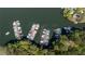 Aerial shot showcases multiple docks in a marina surrounded by lush trees at 1010 Lake Shore Overlook, Alpharetta, GA 30005