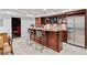 Entertain at home with this bar, complete with seating, cabinetry, and a beverage fridge for all your refreshments at 1010 Lake Shore Overlook, Alpharetta, GA 30005
