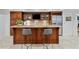 Entertain at home with this bar, complete with seating, cabinetry, and a beverage fridge for all your refreshments at 1010 Lake Shore Overlook, Alpharetta, GA 30005